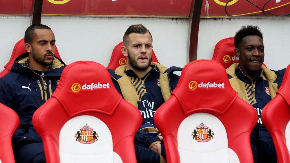 Wilshere, Welbeck, Walcott: What went wrong? 2 SUNDERLAND, ENGLAND - APRIL 24: (L-R) Substitutes Theo Walcott, Jack Wilshere and Danny Welbeck of Arsenal look on from the bench during the Barclays Premier League match between Sunderland and Arsenal at the Stadium of Light on April 24, 2016 in Sunderland, United Kingdom. (Photo by Jan Kruger/Getty Images)