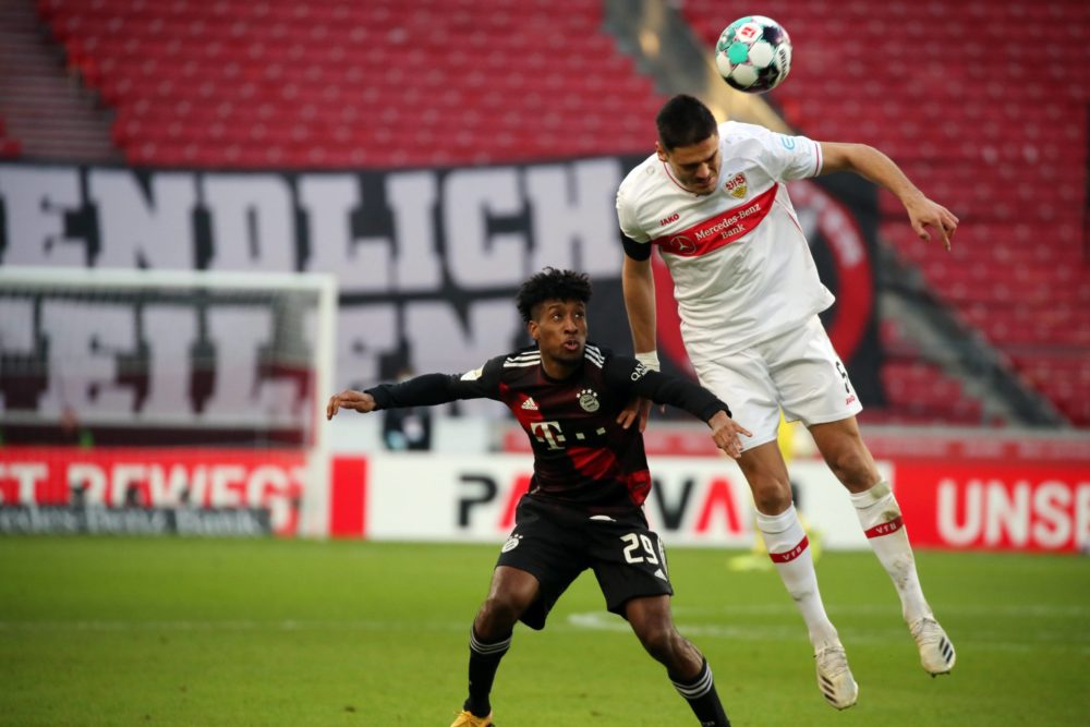 28.11.20, VfB Stuttgart - FC Bayern Münich: Kingsley Coman contests a header with Konstantinos Mavropanos. Photo: Pressefoto Rudel / Robin Rudel / ...