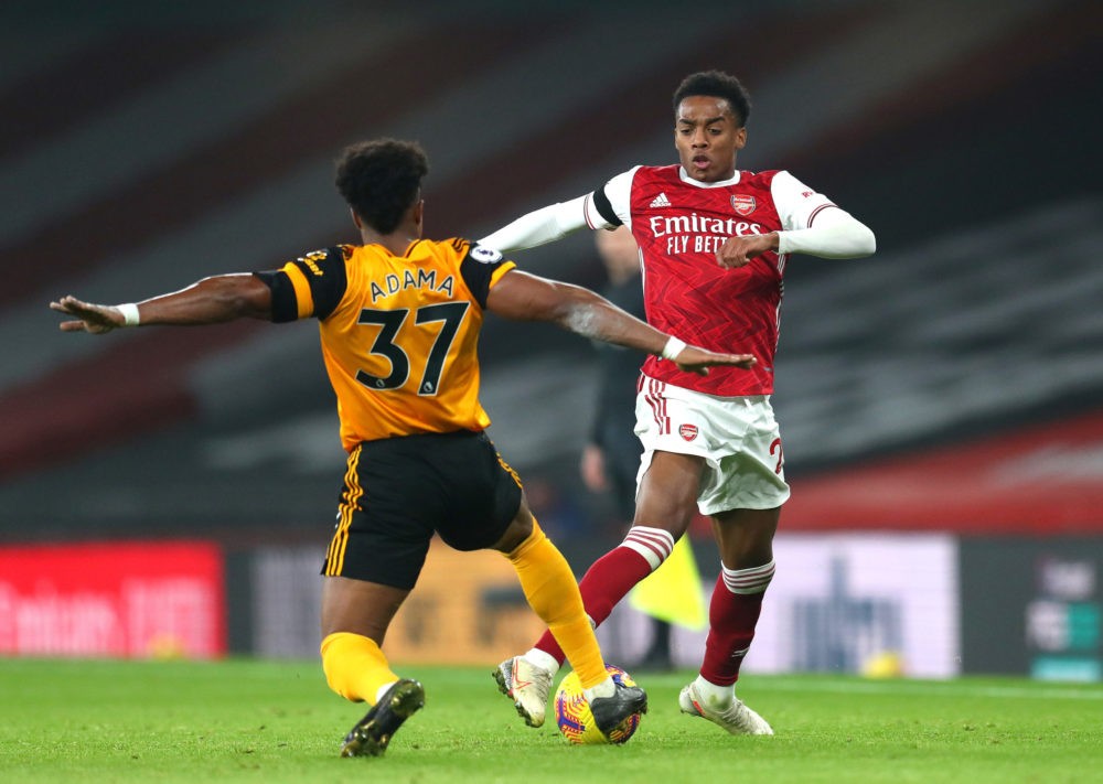 LONDON, ENGLAND - NOVEMBER 29: Joe Willock of Arsenal battles for possession with Adama Traore of Wolverhampton Wanderers during the Premier League...
