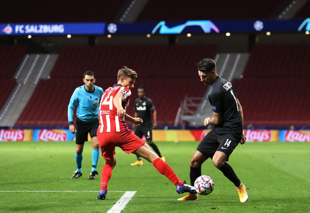 MADRID, SPAIN: Marcos Llorente of Atletico de Madrid battles for possession with Dominik Szoboszlai of RB Salzburg during the UEFA Champions League Group A stage match between Atletico Madrid and RB Salzburg at Estadio Wanda Metropolitano on October 27, 2020. (Photo by Angel Martinez/Getty Images)