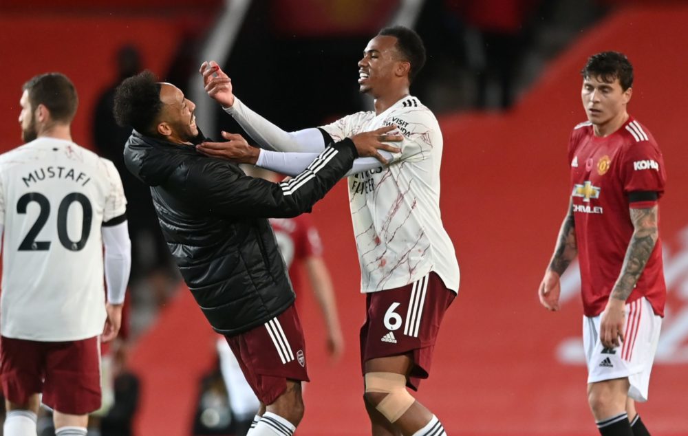 Arsenal's Brazilian defender Gabriel (CR) jokes with Arsenal's Gabonese striker Pierre-Emerick Aubameyang (CL) at the end of the English Premier Le...