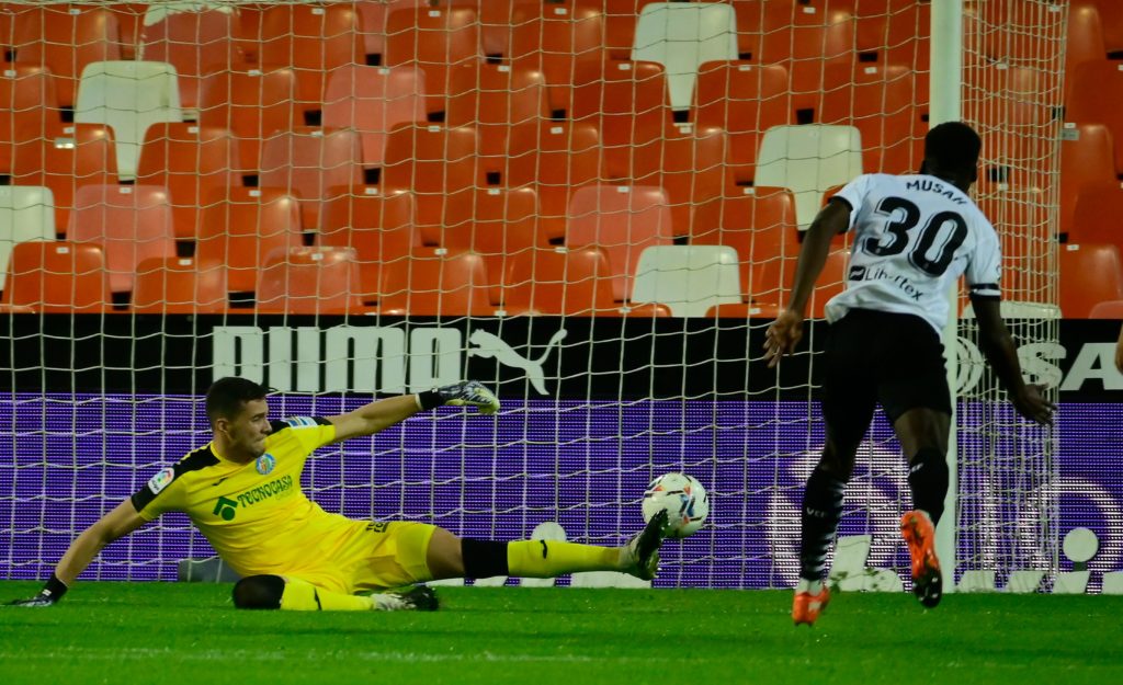 Valencia midfielder Yunus Musah scores a goal during the Spanish League football match between Valencia and Getafe at the Mestalla stadium in Valencia on November 1, 2020. (Photo by JOSE JORDAN/AFP via Getty Images)