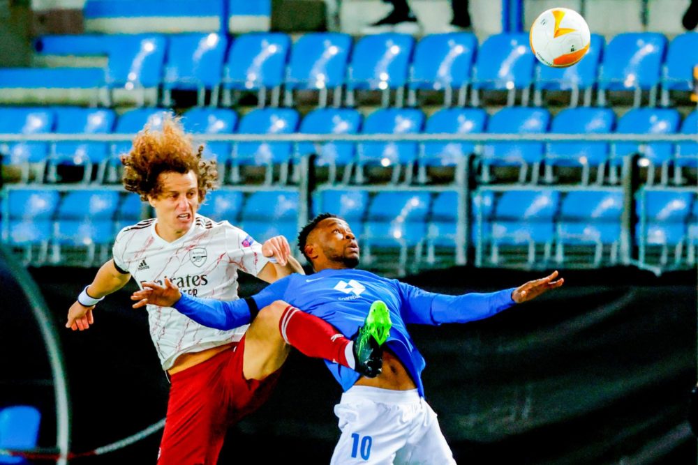 Arsenal's Brazilian defender David Luiz (L) and Molde's Nigerian forward Leke James vie for the ball during the UEFA Europa League group B football...