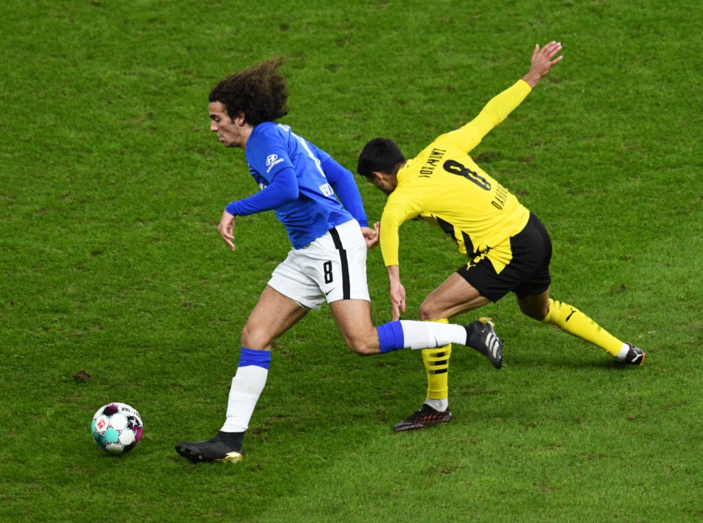 Hertha Berlin's French midfielder Mattéo Guendouzi and Dortmund's German midfielder Mahmoud Dahoud (R) vie for the ball during the German first division Bundesliga football match Hertha BSC Berlin v BVB Borussia Dortmund in Berlin on November 21, 2020. (Photo by ANNEGRET HILSE/POOL/AFP via Getty Images)
