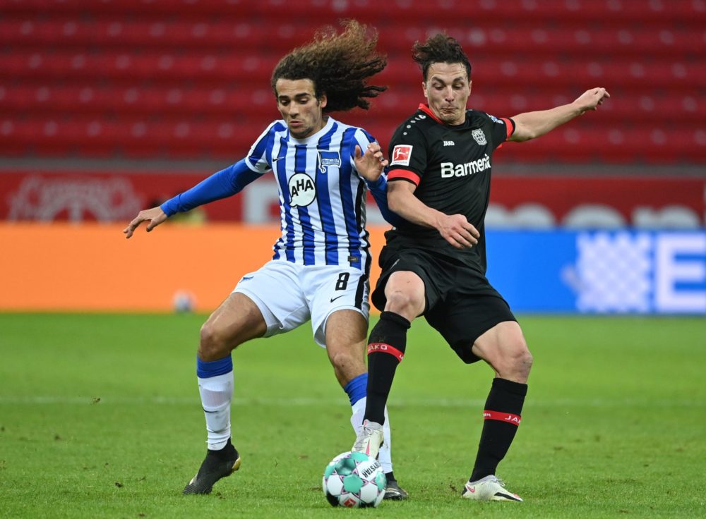 Hertha Berlin's French midfielder Matteo Guendouzi (L) and Leverkusen's Austrian midflielder Julian Baumgartlinger vie for the ball during the Germ...