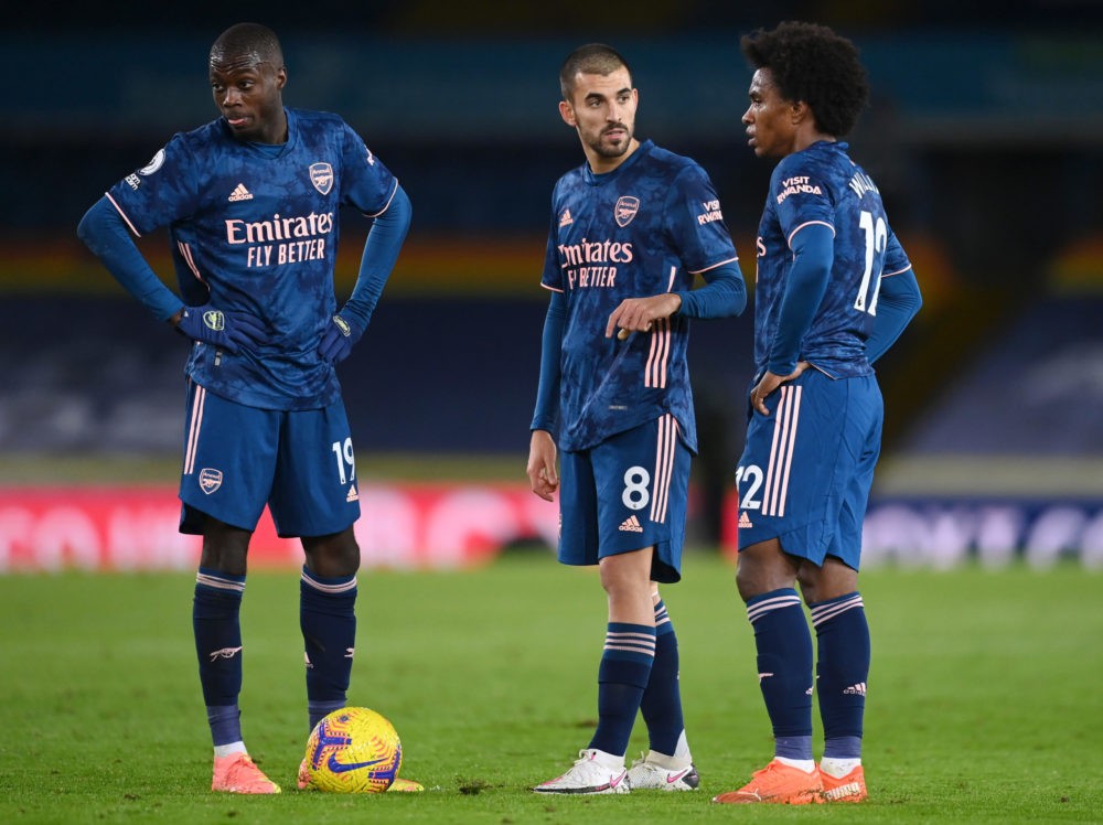 LEEDS, ENGLAND - NOVEMBER 22: Nicolas Pepe of Arsenal (L) Dani Ceballos of Arsenal (C) and Willian of Arsenal (R) look on as they line up for a fre...