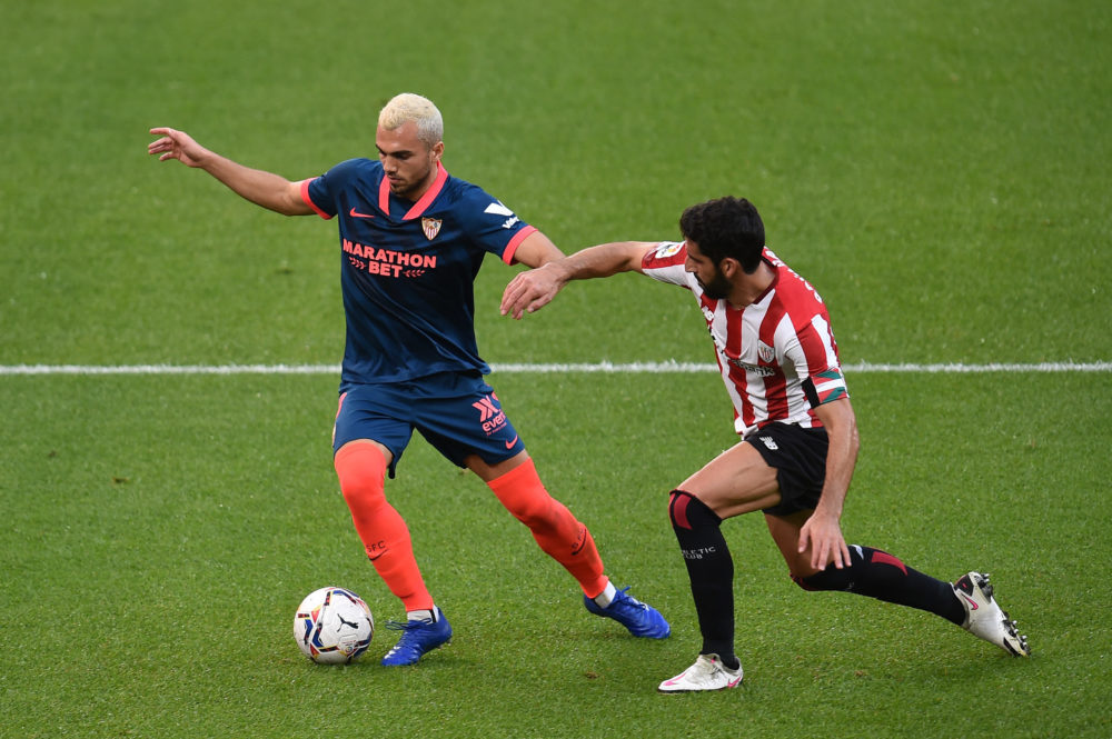 BILBAO, SPAIN: Joan Jordan of Sevilla is challenged by Raul Garcia of Athletic Club during the La Liga Santander match between Athletic Club and Se...