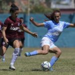 Argentine transgender footballer Mara Gomez (R) of Villa San Carlos vies for the ball with Luciana Nievas of Lanus during an Argentina first division female football match at Genacio Salice stadium in Berisso, Buenos Aires, Argentina on December 7, 2020. - Gomez is the first transgender footballer to play in the first division of the Argentine female league. (Photo by JUAN MABROMATA / AFP)