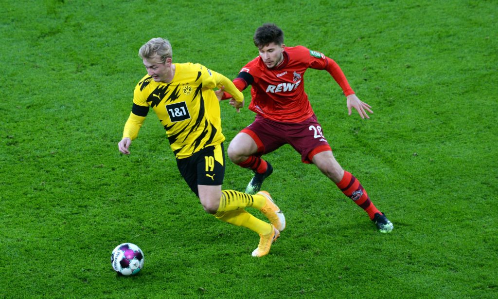 German media issue transfer update on strongly-linked Arsenal target 2 Dortmund's German forward Julian Brandt and Cologne's German midfielder Elvis Rexhbecaj vie for the ball during the German first division Bundesliga football match BVB Borussia Dortmund v 1.FC Cologne at the Signal Iduna Park Stadium in Dortmund, western Germany, on November 28, 2020. (Photo by UWE KRAFT/AFP via Getty Images)