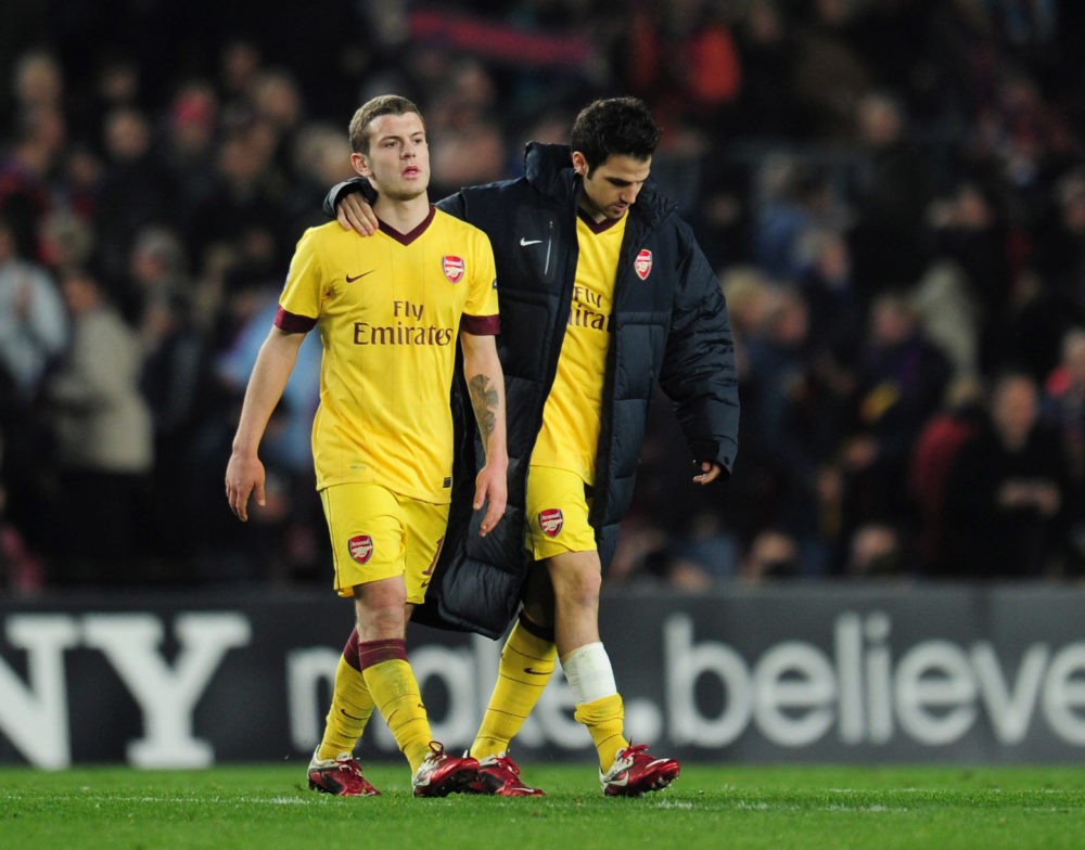 BARCELONA, SPAIN - MARCH 08:  Jack Wilshere and Cesc Fabregas of Arsenal leave the field at the end of the UEFA Champions League round of 16 second leg match between Barcelona and Arsenal at the Nou Camp Stadium on March 8, 2011 in Barcelona, Spain.  (Photo by Shaun Botterill/Getty Images)