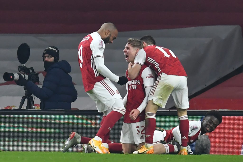 Arsenal's English midfielder Emile Smith Rowe (C) celebrates with teammates after scoring the opening goal of the English FA Cup third round football match between Arsenal and Newcastle United at the Emirates Stadium in London on January 9, 2021. (Photo by Glyn KIRK / AFP)