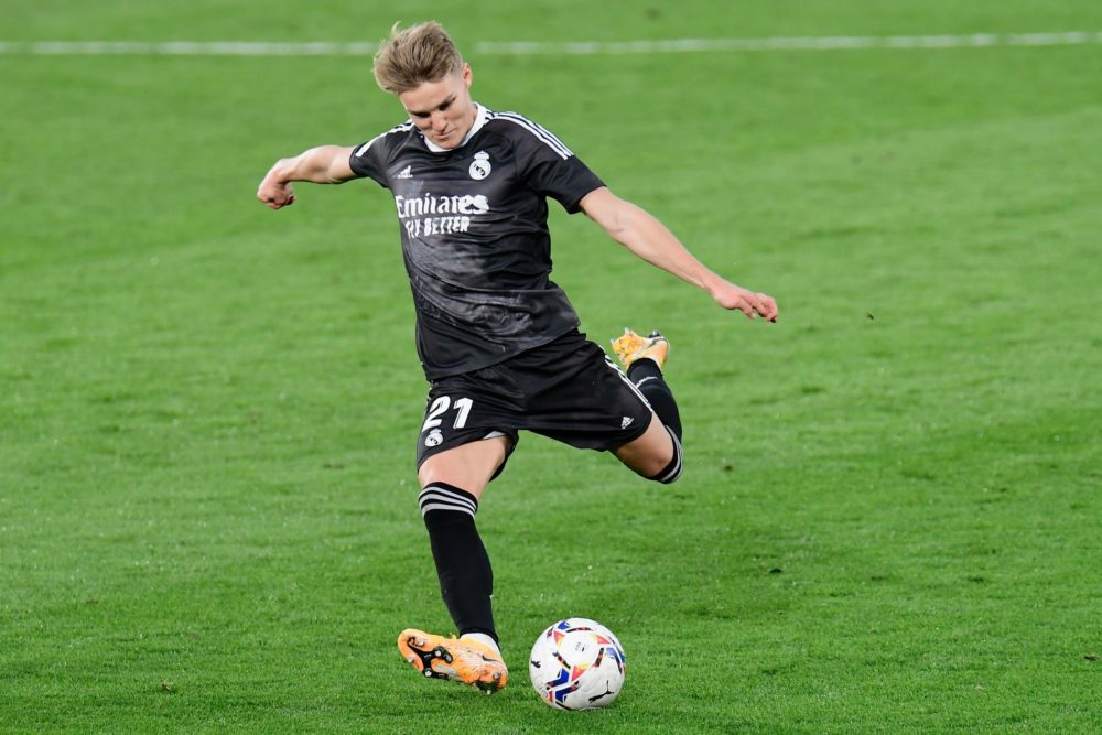 Real Madrid's Norwegian midfielder Martin Odegaard controls the ball during the Spanish League football match between Villarreal and Real Madrid at...