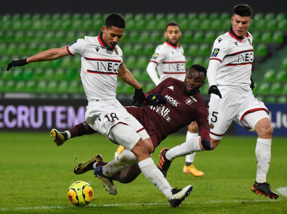 Nice's French defender William Saliba (L) is challenged by Metz's French forward Thierry Ambrose during the French L1 football match between Footba...