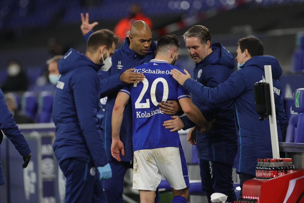 GELSENKIRCHEN, GERMANY: Sead Kolasinac of FC Schalke 04 goes off injured during the Bundesliga match between FC Schalke 04 and 1. FC Koeln at Veltins-Arena on January 20, 2021. (Photo by Friedemann Vogel - Pool/Getty Images)