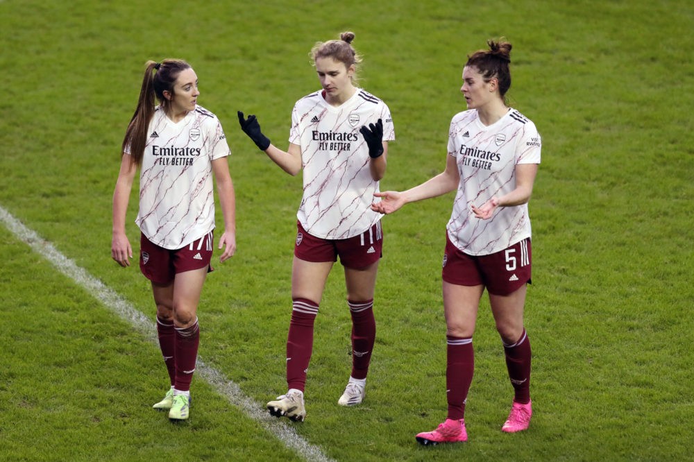 READING, ENGLAND - JANUARY 17: Lisa Evans , Vivianne Miedema and Jennifer Beattie of Arsenal speak as they walk off the pitch after the Barclays FA...