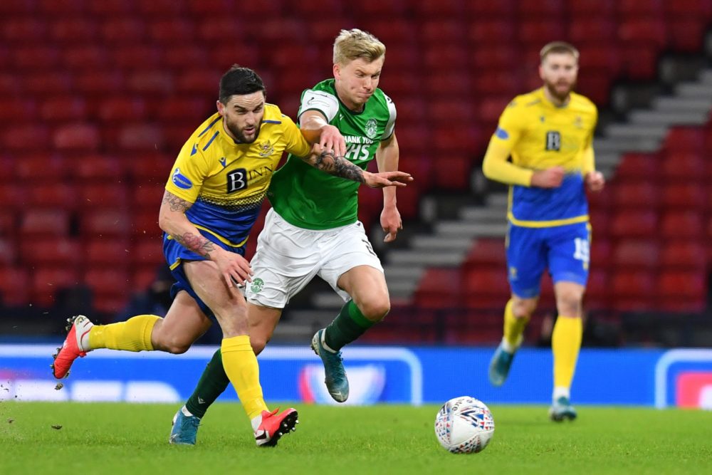 GLASGOW, SCOTLAND: Josh Doig of Hibernian and Craig Conway of St Johnstone battle for possession during the Betfred Cup Semi-Final match between St...