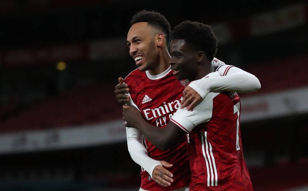 Arsenal's Bukayo Saka with Pierre-Emerick Aubameyang. Issue date: Monday February 15, 2021. Copyright: Catherine Ivill