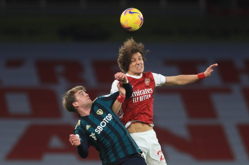 LONDON, ENGLAND - FEBRUARY 14: David Luiz of Arsenal wins a header over Patrick Bamford of Leeds United during the Premier League match between Ars...