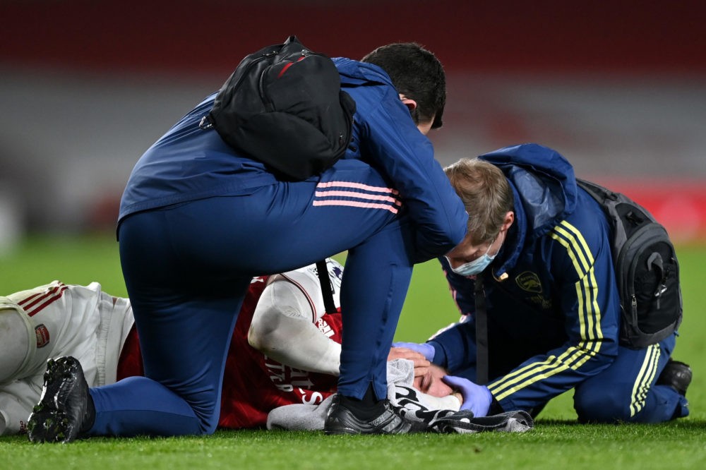 LONDON, ENGLAND: Rob Holding of Arsenal receives medical treatment during the Premier League match between Arsenal and Manchester City at Emirates ...