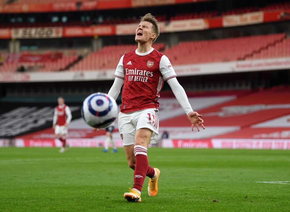 LONDON, ENGLAND - FEBRUARY 21: Martin Odegaard of Arsenal reacts to losing control of the ball during the Premier League match between Arsenal and ...