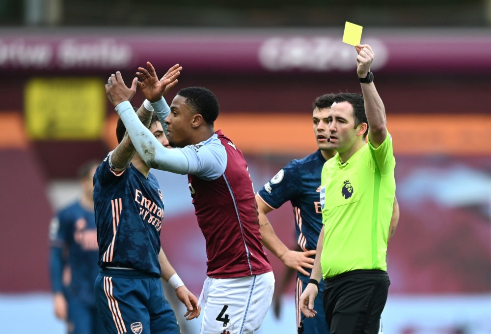 Referee does it again to Arsenal 2 BIRMINGHAM, ENGLAND - FEBRUARY 06: Referee Chris Kavanagh awards Ezri Konsa of Aston Villa a yellow card during the Premier League match between Aston Villa and Arsenal at Villa Park on February 06, 2021 in Birmingham, England. Sporting stadiums around the UK remain under strict restrictions due to the Coronavirus Pandemic as Government social distancing laws prohibit fans inside venues resulting in games being played behind closed doors. (Photo by Shaun Botterill/Getty Images)