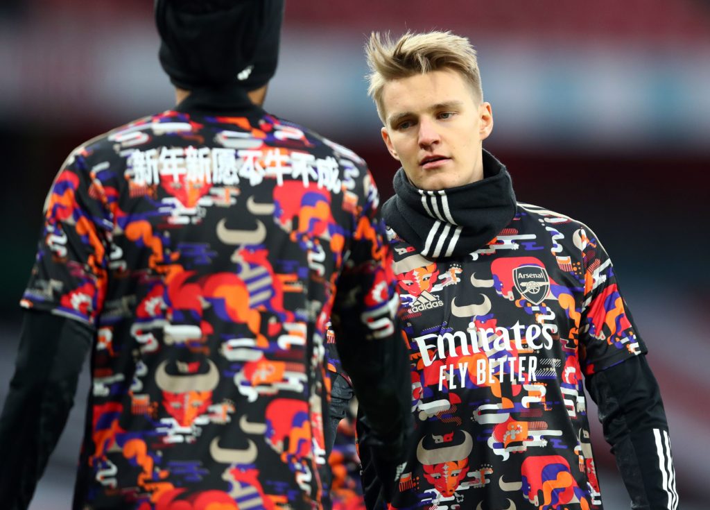 Martin Odegaard injury concern 2 Arsenal's Norwegian midfielder Martin Odegaard (R) warms up for the English Premier League football match between Arsenal and Leeds United at the Emirates Stadium in London on February 14, 2021. (Photo by Julian Finney / POOL / AFP)