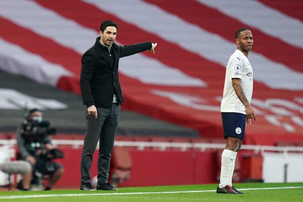 Arsenal's Spanish manager Mikel Arteta (L) gestures on the touchline as Manchester City's English midfielder Raheem Sterling (R) looks on during th...