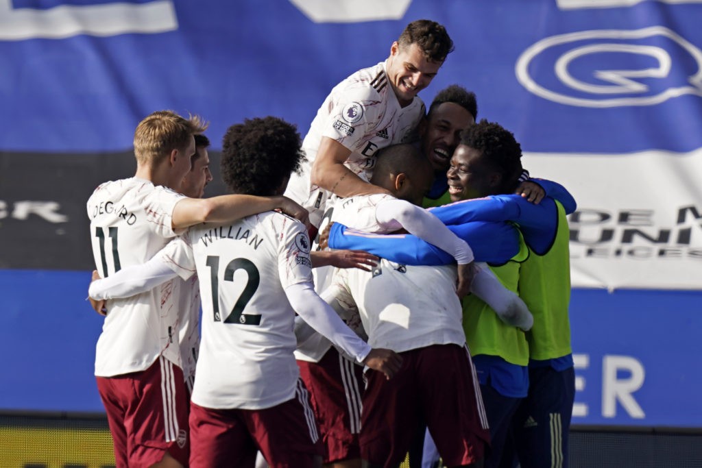 Arsenal's French-born Ivorian midfielder Nicolas Pepe celebrates with teammates after scoring their third goal during the English Premier League football match between Leicester City and Arsenal at King Power Stadium in Leicester, central England on February 28, 2021. (Photo by Tim Keeton / POOL / AFP)