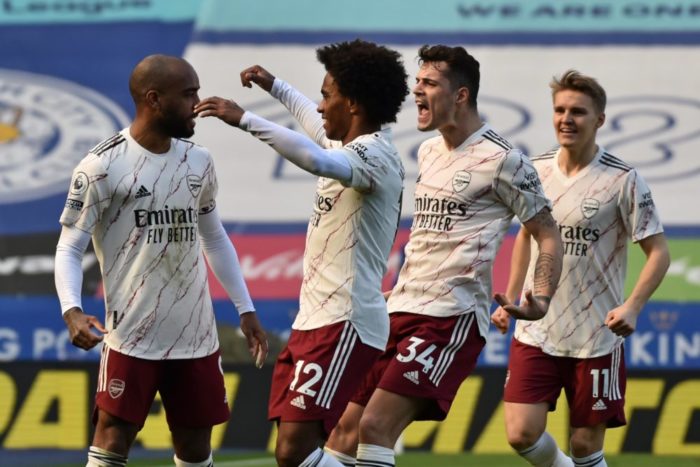 Arsenal's French striker Alexandre Lacazette (L) celebrates with teammates after scoring their second goal from the penalty spot during the English Premier League football match between Leicester City and Arsenal at King Power Stadium in Leicester, central England on February 28, 2021. (Photo by Rui Vieira / POOL / AFP)