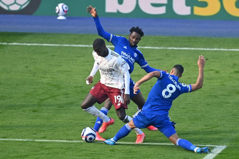 Arsenal's French-born Ivorian midfielder Nicolas Pepe is fouled, just outside the penalty area after a VAR (Video Assistant Referee) review during ...