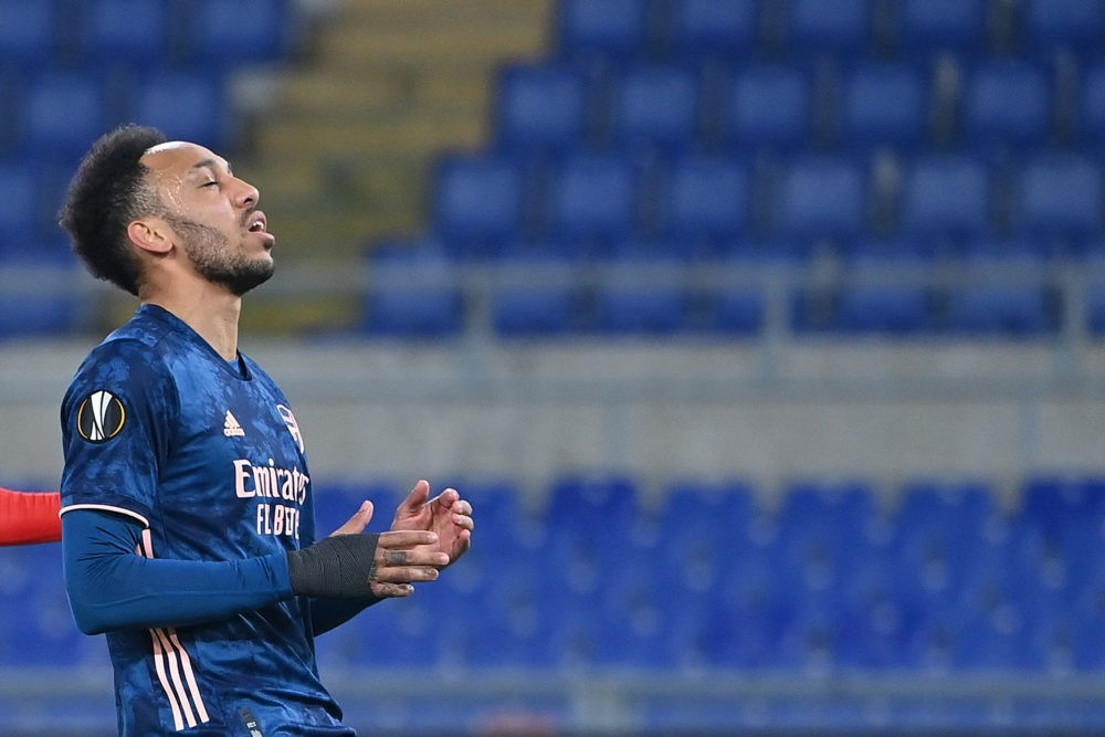 Arsenal's Gabonese striker Pierre-Emerick Aubameyang reacts after missing a goal opportunity during the UEFA Europa League round of 32 first leg fo...