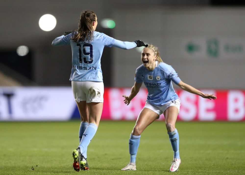 MANCHESTER, ENGLAND - FEBRUARY 12: Caroline Weir of Manchester City celebrates scoring her sides third goal with Steph Houghton of Manchester City during the Barclays FA Women's Super League match between Manchester City Women and Manchester United Women at Manchester City Football Academy on February 12, 2021 in Manchester, England. Sporting stadiums around the UK remain under strict restrictions due to the Coronavirus Pandemic as Government social distancing laws prohibit fans inside venues resulting in games being played behind closed doors. (Photo by Naomi Baker/Getty Images)