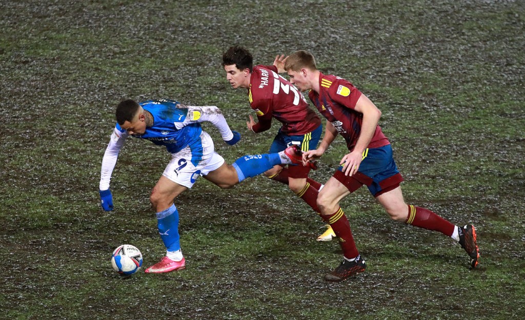 William Saliba continues to impress: Arsenal loan watch 3 PETERBOROUGH, ENGLAND: Jonson Clarke-Harris of Peterborough United moves away from Josh Harrop and Mark McGuinness (R) during the Sky Bet League One match between Peterborough United and Ipswich Town at Weston Homes Stadium on February 09, 2021. (Photo by David Rogers/Getty Images)