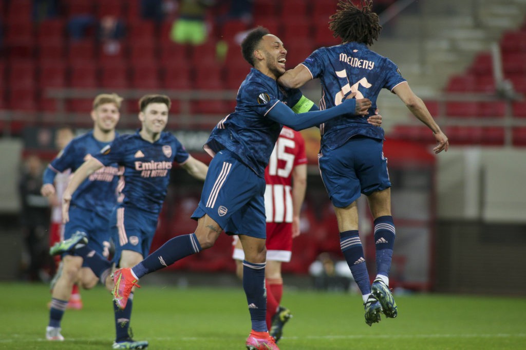 Mohamed Elneny of Arsenal celebrates with teammates after scoring the side's third goal during the UEFA Europa League match at Karaiskakis Stadium, Piraeus. Copyright: Focus Images