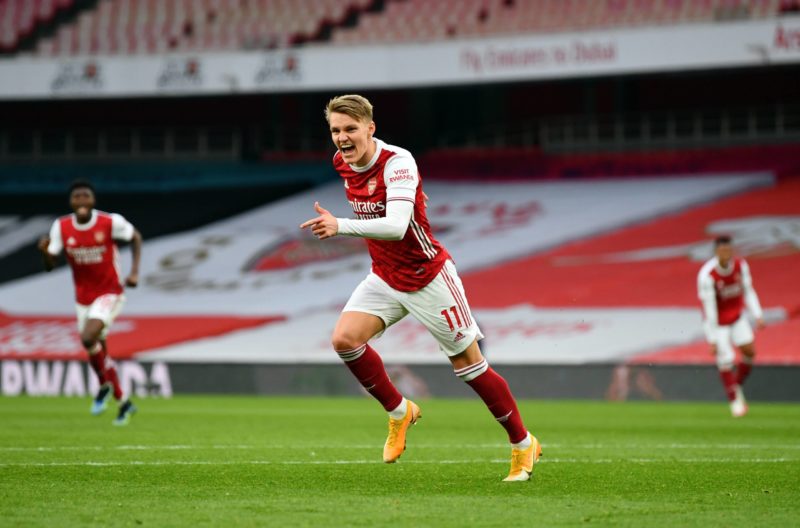 Martin Odegaard celebrates scoring Arsenal's first goal of the game against Spurs during the Premier League match at Emirates Stadium, London. Pict...