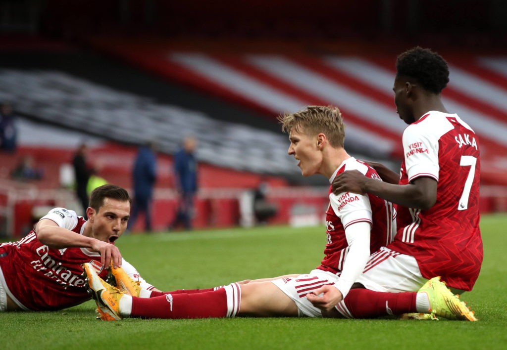 Arsenal v Tottenham Hotspur - Premier League - Emirates Stadium Arsenal s Martin Odegaard centre celebrates scoring their side s first goal of the game during the Premier League match at Emirates Stadium, London. Picture date: Sunday March 14, 2021. Copyright: Nick Potts
