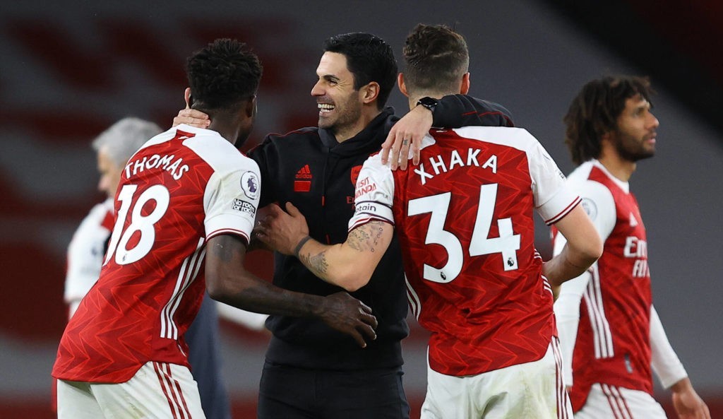 Arsenal v Tottenham Hotspur - Premier League - Emirates Stadium Arsenal manager Mikel Arteta centre celebrates with Thomas Partey left and Granit Xhaka after the Premier League match at Emirates Stadium, London. Picture date: Sunday March 14, 2021. Copyright: xulian Finney