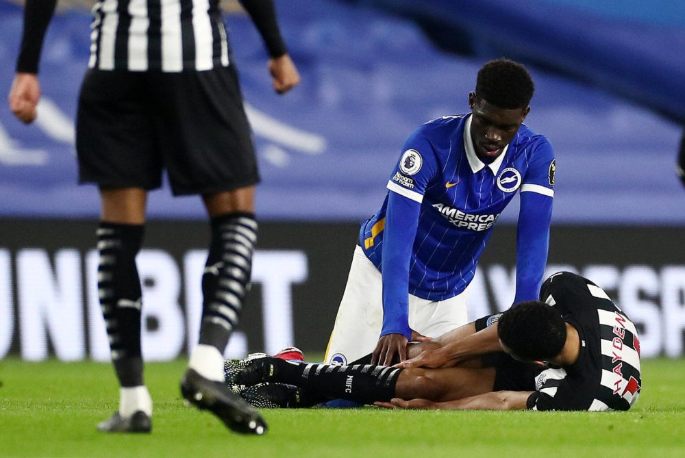 Isaac Hayden of Newcastle United is seen on the floor with an injury on 20th March 2021. Brighton & Hove Albion v Newcastle United, Premier League....