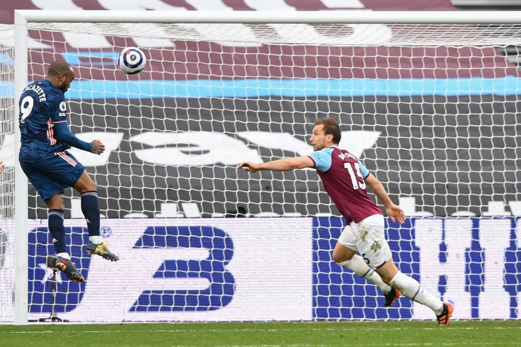 Alexandre Lacazette of Arsenal scores a header from very close range to make it 3-3 West Ham United v Arsenal. The London Stadium, London, UK - 21 Mar 2021. Mandatory Credit: Photo by Simon Dael/BPI/Shutterstock