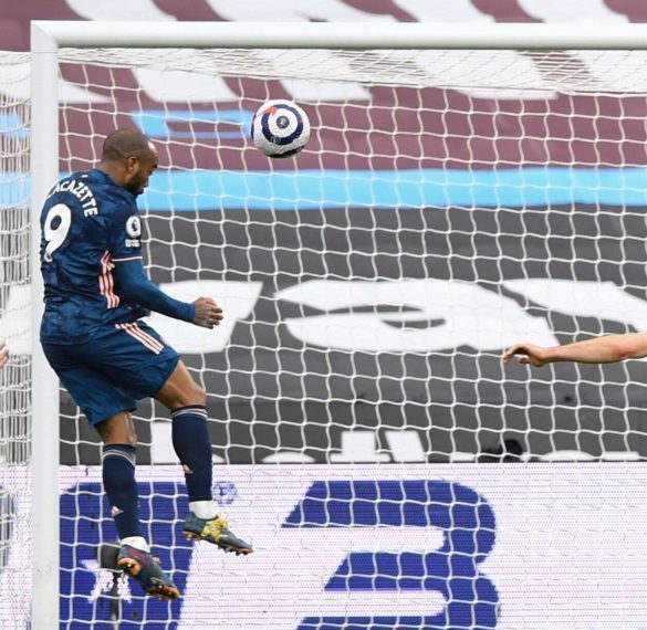 Alexandre Lacazette of Arsenal scores a header from very close range to make it 3-3 West Ham United v Arsenal. The London Stadium, London, UK - 21 ...