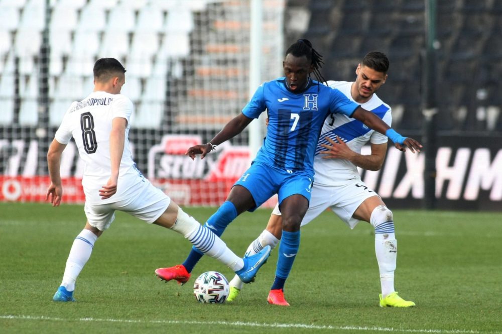 28.03.2021, Greece versus Honduras. Sotiris Alexandropoulos (L) and Konstantinos Mavropanos (R) of Greece up against Alberth Elis M of Honduras. Ph...