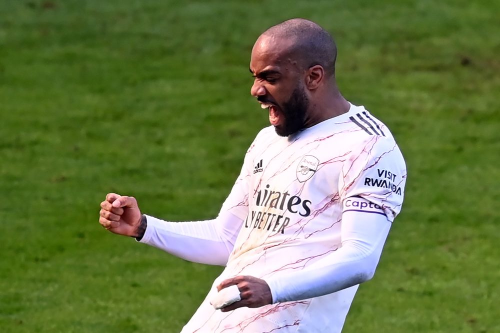 Arsenal's French striker Alexandre Lacazette celebrates after scoring their second goal from the penalty spot during the English Premier League football match between Leicester City and Arsenal at King Power Stadium in Leicester, central England on February 28, 2021. (Photo by Michael Regan / POOL / AFP)