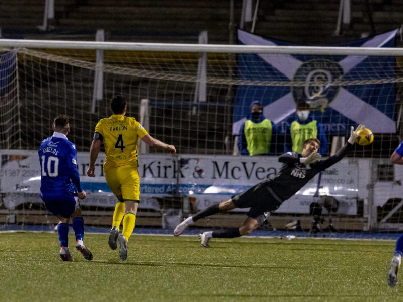Palmerston Park, Dumfries, Scotland Scottish Cup Third Round, Queen of the South versus Hibernian Matt Macey of Hibernian makes a save from Connor Shields of QOTS ActionPlus Alan Rennie