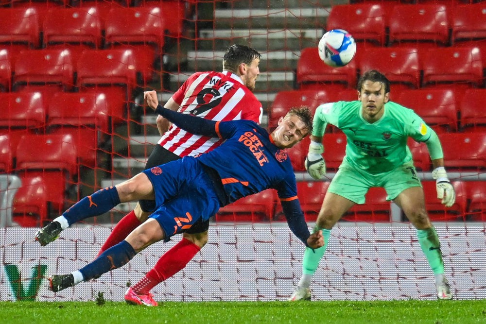 Daniel Ballard of Blackpool FC dives to head clear during the EFL Sky Bet League 1 match between AFC Sunderland and Blackpool at the Stadium Of Lig...
