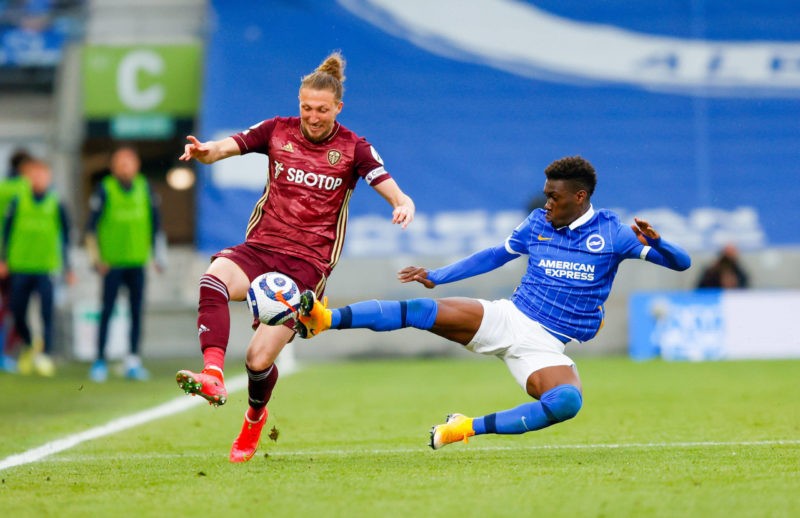 Brighton and Hove Albion v Leeds United Premier League 01/05/2021. Leeds United defender Luke Ayling 2 is tackled by Brighton and Hove Albion midfi...