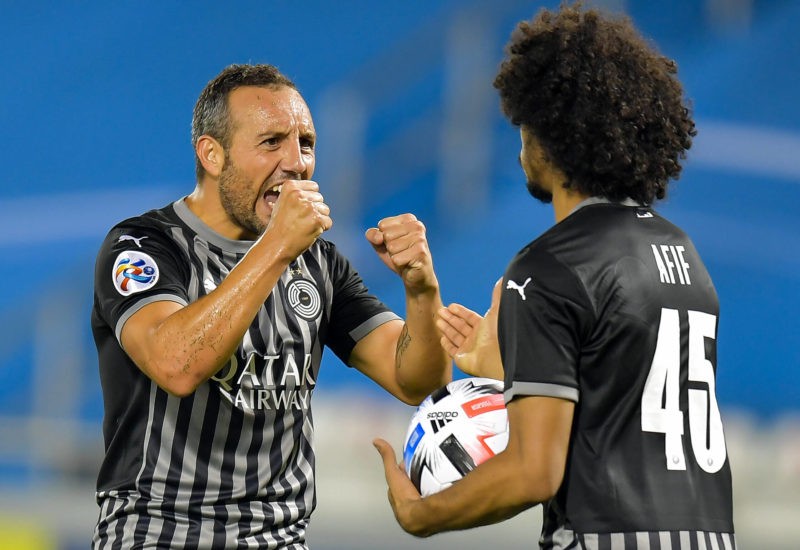 Santi Cazorla L of Al Sadd SC celebrates with his teammate Akram Afif after scoring a goal during the AFC Asian Champions League group D football m...