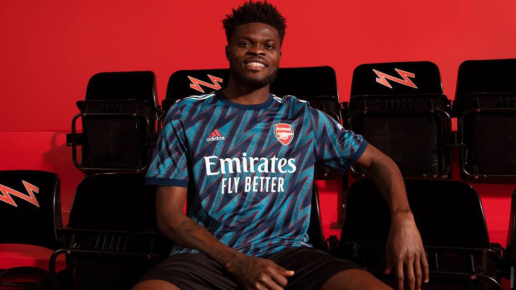 Thomas Partey modelling the new Arsenal third kit for 2021/22 (Photo via Arsenal.com)