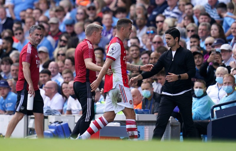 Manchester City v Arsenal - Premier League - Etihad Stadium Arsenals Granit Xhaka walks past manager Mikel Arteta after being sent off during the Premier League match at the Etihad Stadium, Manchester. Picture date: Saturday August 28, 2021.
