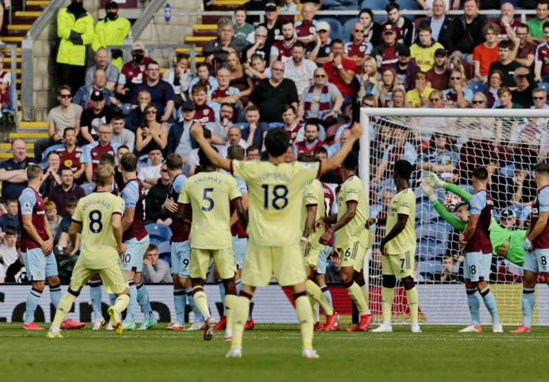 Football - 2021 / 2022 Premier League - Burnley vs. Arsenal Martin Odegaard of Arsenal curls a free kick around the Burnley wall to put his team 1-...