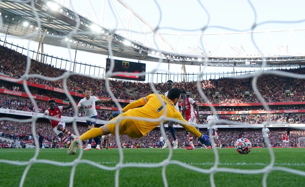 Arsenal v Tottenham Hotspur - Premier League - Emirates Stadium Arsenal s Bukayo Saka scores their side s third goal of the game during the Premier League match at the Emirates Stadium, London. Picture date: Sunday September 26, 2021.